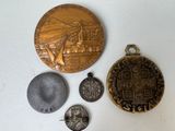 a gold medal, a silver medal, and a silver medal