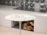 a white table with a marble top in a room