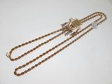 an image of a gold chain with a flower on top of it