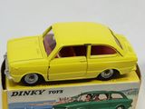 a yellow toy car sitting on top of a box