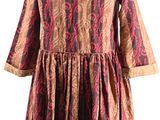 the back of a dress with a red and brown pattern on it