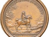 an old coin with a man riding a horse on it ' s back