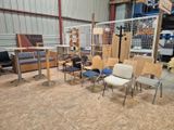 many chairs and tables in a room with a volleyball net in the background