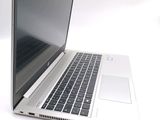 a laptop computer that is sitting on a white surface