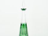an image of a green glass decanter on a white background