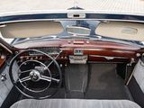 dashboard of a classic car with leather seats and a steering wheel