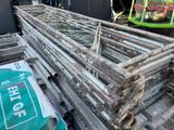 a large pile of wood and a pile of plastic bags