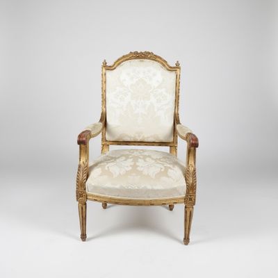 an image of a chair with a gold frame and a white upholstered seat