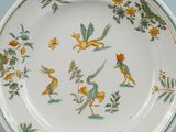 an image of a plate with birds and flowers on it