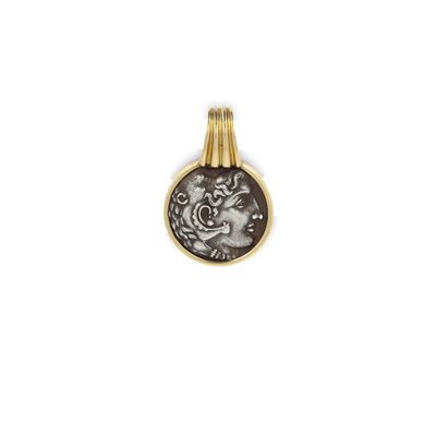 une pièce d'or et d'argent sur laquelle est représenté un visage