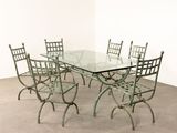 a glass table with four chairs and a glass top