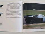 an open book with a picture of a race car on it