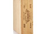 a wooden box with a bottle of wine inside of it