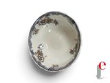 a white bowl with blue and gold designs on it