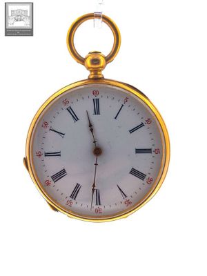 a gold pocket watch with roman numerals on the face