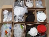 a cardboard box filled with assorted items on the floor