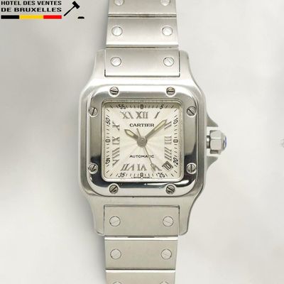 an image of a silver watch with a white dial
