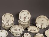 a lot of plates and bowls that are sitting on a table