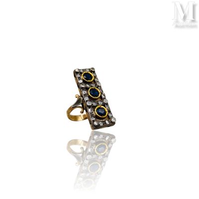 a close up of a ring on a white surface