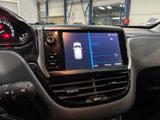 the dashboard of a car with a digital display in the center of it