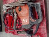 a red box with a hammer and other tools on it