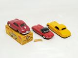 three toy cars that are sitting on top of a box
