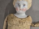 a small doll that is sitting on a table