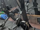 a gym with a lot of equipment in the room