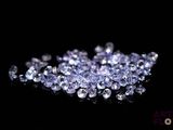 some very pretty blue diamonds on a black surface