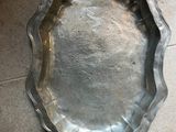 a silver tray on the floor on the floor