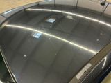 a close up of a car ' s roof with the sun shining