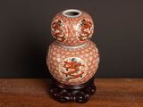 a vase that is sitting on top of a wooden table