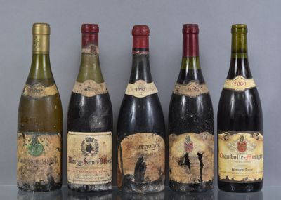 several bottles of wine are lined up on a table