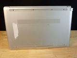 a laptop that is sitting on a table with a black background