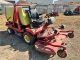 an image of a lawn mower parked in a yard