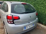 a silver car parked on the side of the road