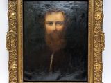 portrait of a bearded man with a pipe in a gold frame