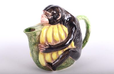 un singe assis à l'intérieur d'une tasse