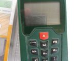 a green calculator sitting next to a package of cards