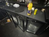 a table with drinks and condiments on top of it
