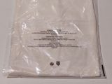 a plastic bag with a label on it sitting on a table