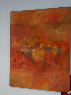 a painting hanging on a wall in a room