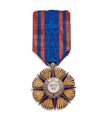 l'image d'une médaille surmontée d'une étoile