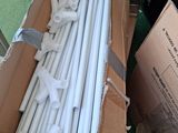 a cardboard box with a bunch of white pipes in it