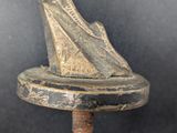 an old statue of a woman holding a bird on top of a pedestal