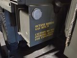 a military vehicle that has a sign on the side of it