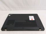 a black laptop with a red button on it