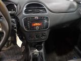 a dashboard of a car with a digital clock on it