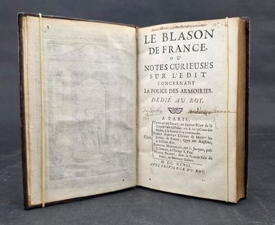 an old book opened to reveal a page with writing on it