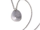 necklace with a silver stone on a silver chain on a white background